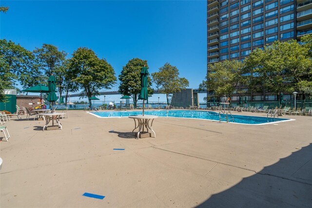 166-25 Powells Cove Blvd Unit 16M, Beechhurst, NY 11357 - community pool featuring a patio area