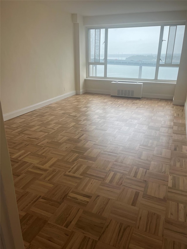 166-25 Powells Cove Blvd Unit 16M, Beechhurst, NY 11357 - spare room featuring baseboards