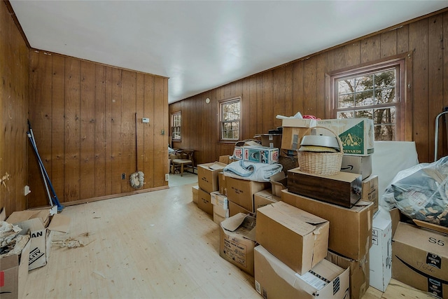 misc room featuring wooden walls and light hardwood / wood-style flooring