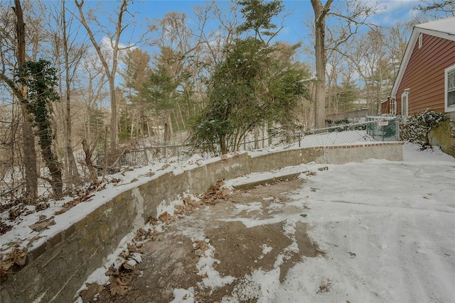 view of yard layered in snow