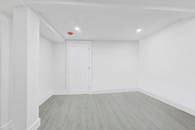 empty room with light hardwood / wood-style flooring