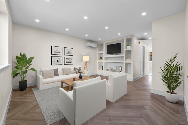 living room with a wall mounted AC, built in features, and light parquet flooring