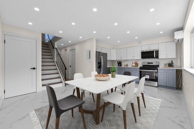 dining area featuring a wall mounted AC