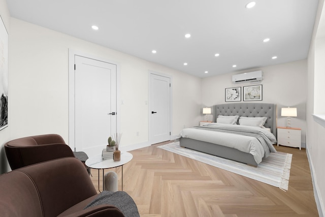 bedroom featuring light parquet floors and a wall mounted air conditioner