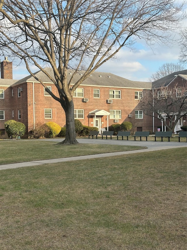 view of community featuring a yard