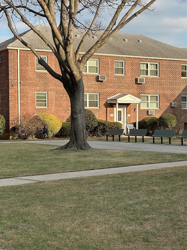 exterior space featuring an AC wall unit