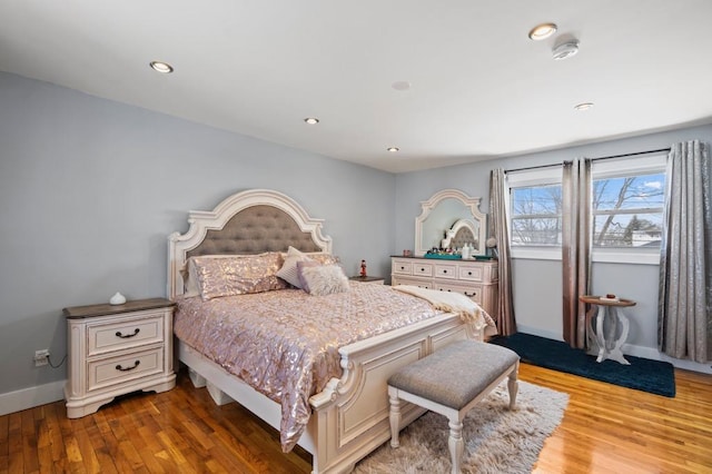 bedroom with hardwood / wood-style flooring