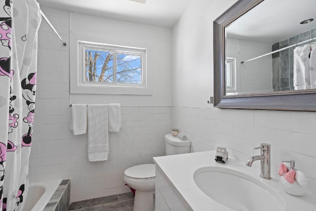 full bathroom featuring vanity, shower / tub combo with curtain, and toilet