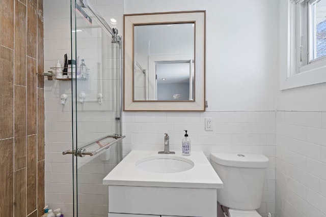 bathroom featuring vanity, toilet, and walk in shower