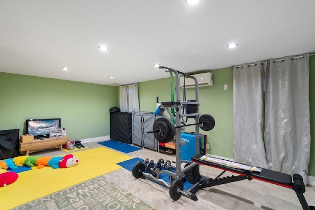 exercise room featuring a wall mounted AC