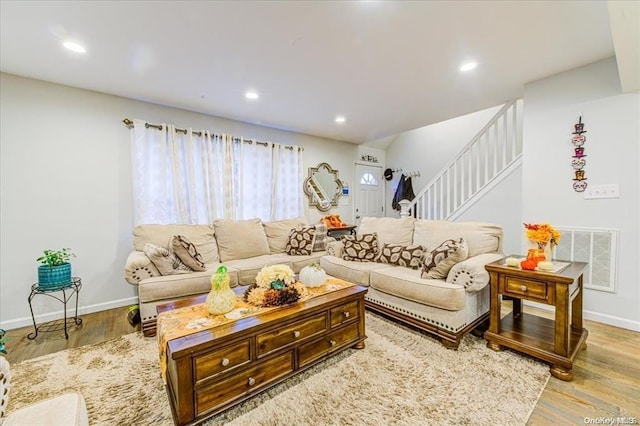 living room with light hardwood / wood-style flooring