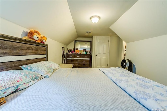 bedroom with lofted ceiling