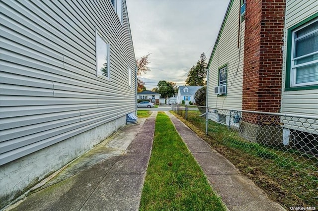 view of side of property with cooling unit