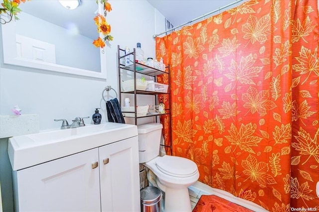 bathroom with vanity and toilet