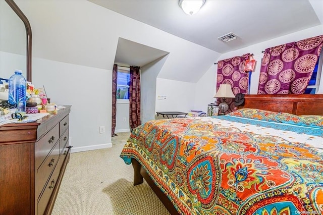 carpeted bedroom featuring lofted ceiling