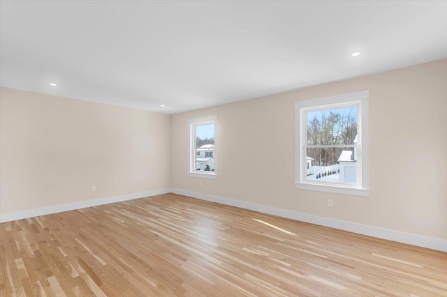 empty room with light hardwood / wood-style floors