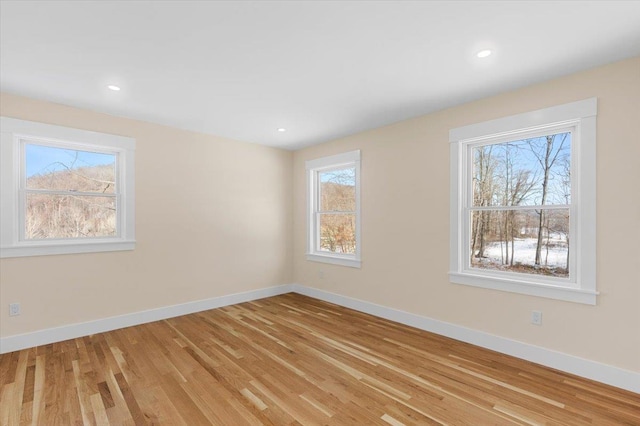 unfurnished room featuring light hardwood / wood-style flooring