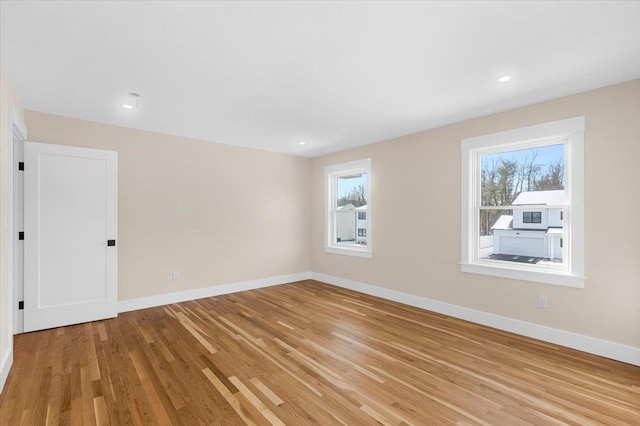 spare room featuring light hardwood / wood-style floors