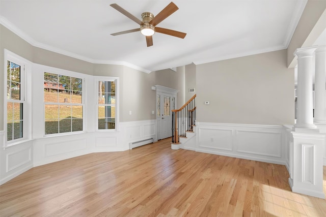 interior space with ornamental molding, light hardwood / wood-style flooring, ceiling fan, and a baseboard heating unit