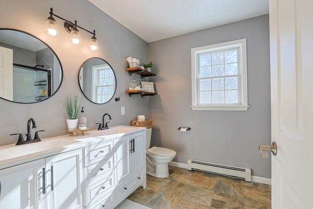 bathroom featuring baseboard heating, toilet, vanity, and an enclosed shower