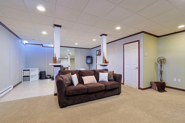 carpeted living room with ornamental molding and a baseboard heating unit