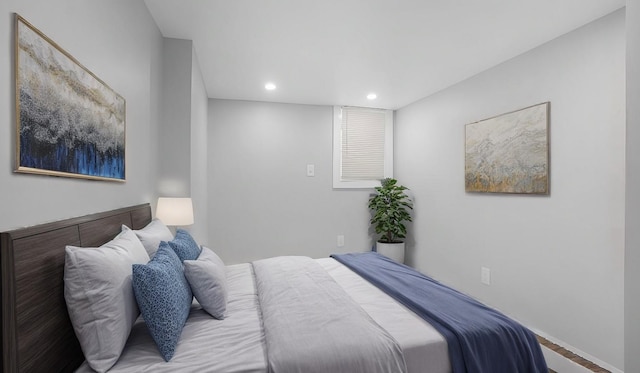 bedroom with wood-type flooring