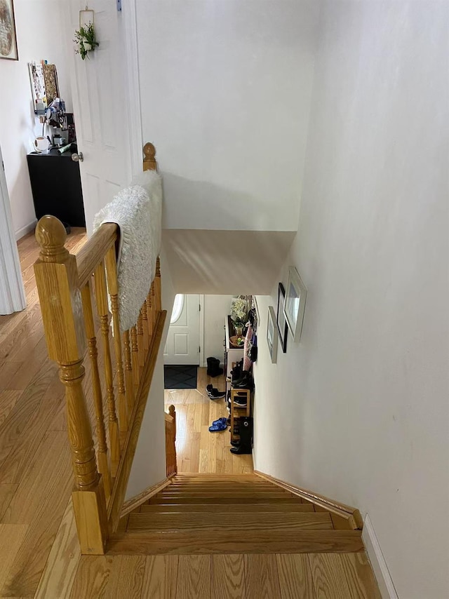 staircase featuring hardwood / wood-style flooring