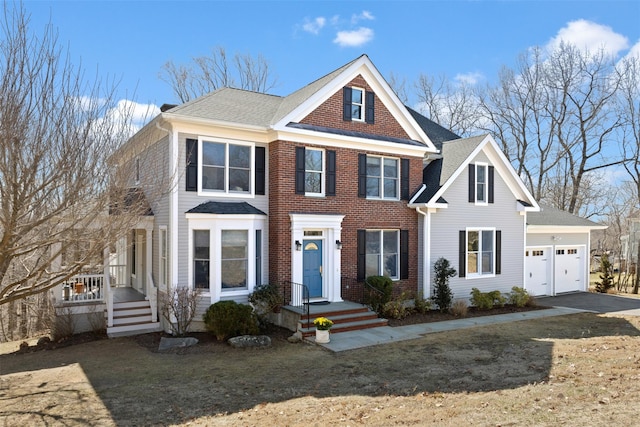 view of front of house with aphalt driveway, an attached garage, brick siding, and a shingled roof