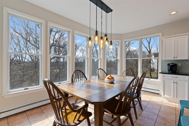 dining space with recessed lighting, a baseboard radiator, and light tile patterned flooring