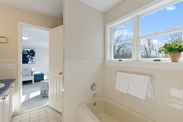 full bathroom featuring vanity, ensuite bath, a bath, and tile patterned floors