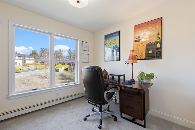 home office featuring a baseboard heating unit, baseboards, and carpet floors