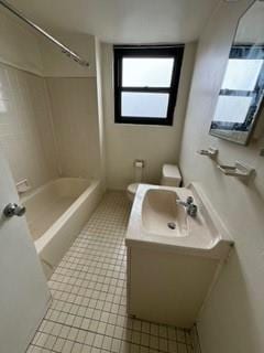 full bathroom featuring vanity,  shower combination, tile patterned floors, and toilet