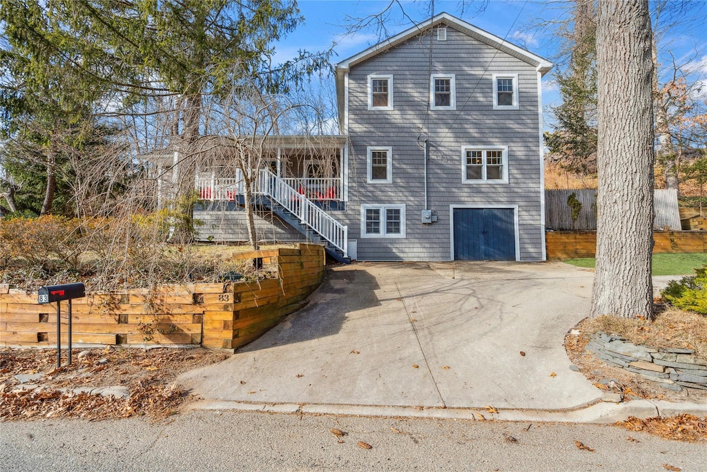 view of front facade featuring a garage and covered porch