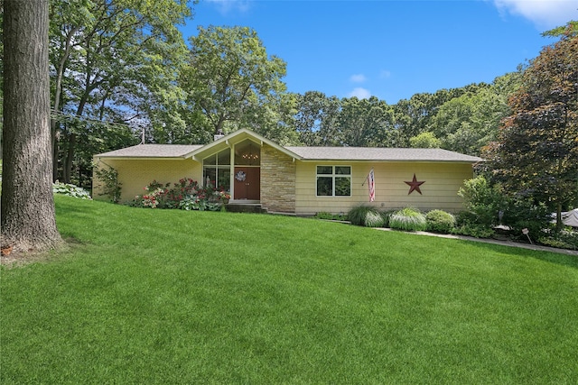 ranch-style house with a front lawn