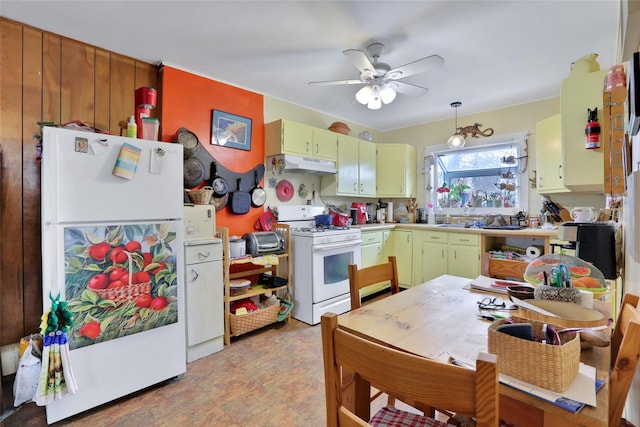 kitchen featuring decorative light fixtures, white appliances, and ceiling fan