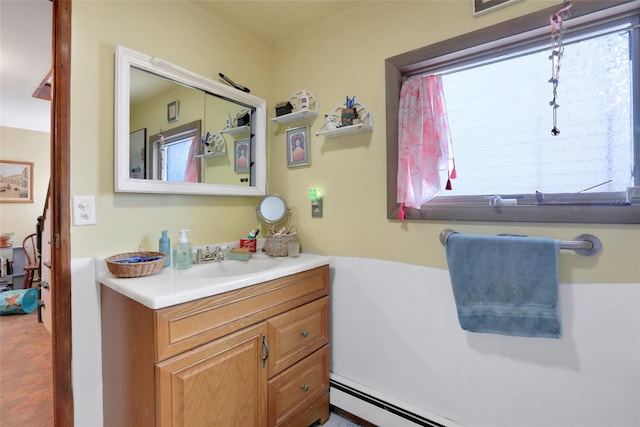 bathroom featuring a baseboard radiator and vanity