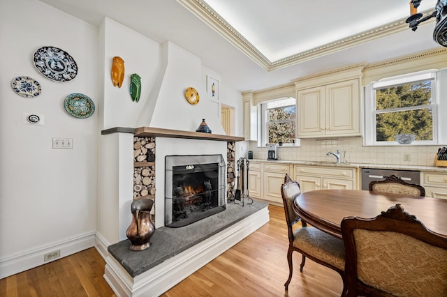 dining space featuring light hardwood / wood-style floors and sink