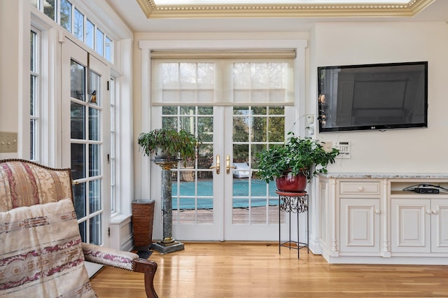 entryway with light wood-type flooring and french doors