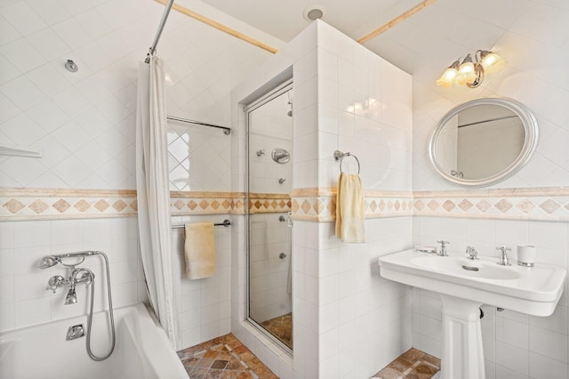 bathroom with tile walls and shower / bath combination with curtain