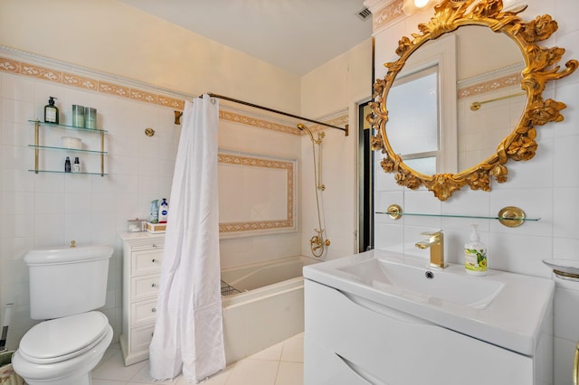 full bathroom with tile patterned flooring, tile walls, toilet, and shower / bath combination with curtain