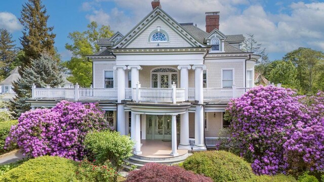 11 Vermont Ave, White Plains, NY 10606 - neoclassical / greek revival house featuring a porch, a balcony, and a chimney