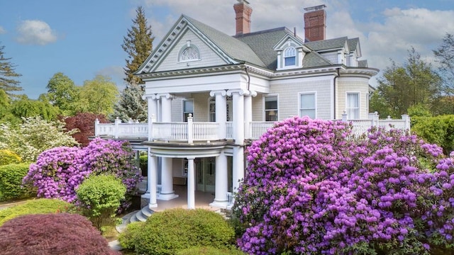 11 Vermont Ave, White Plains, NY 10606 - back of property with a porch and a chimney
