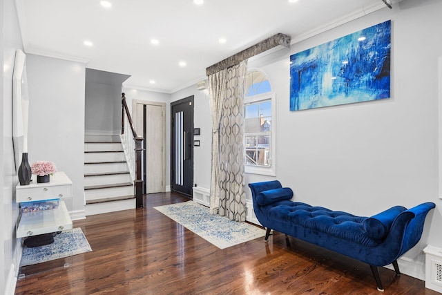 interior space featuring dark hardwood / wood-style floors and crown molding