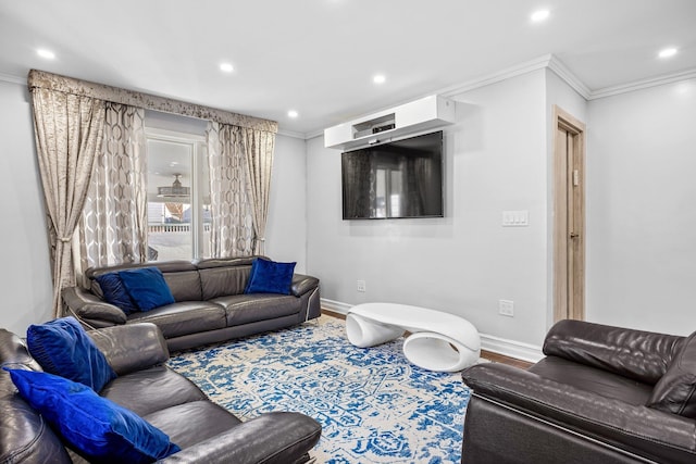 living room with hardwood / wood-style floors and ornamental molding