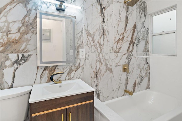 full bathroom featuring vanity, toilet, shower / washtub combination, and tile walls