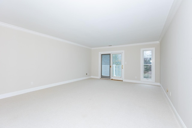 carpeted spare room featuring ornamental molding