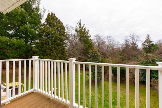 wooden terrace with a yard