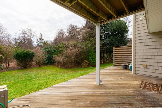 wooden terrace with a lawn