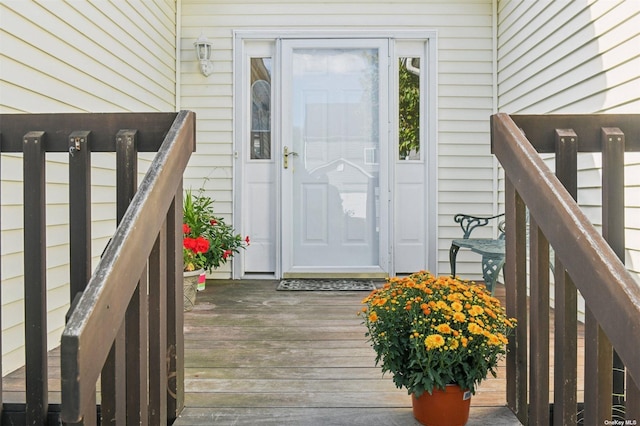 doorway to property featuring a wooden deck