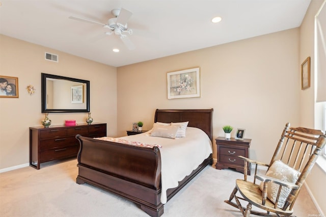 bedroom featuring light colored carpet and ceiling fan